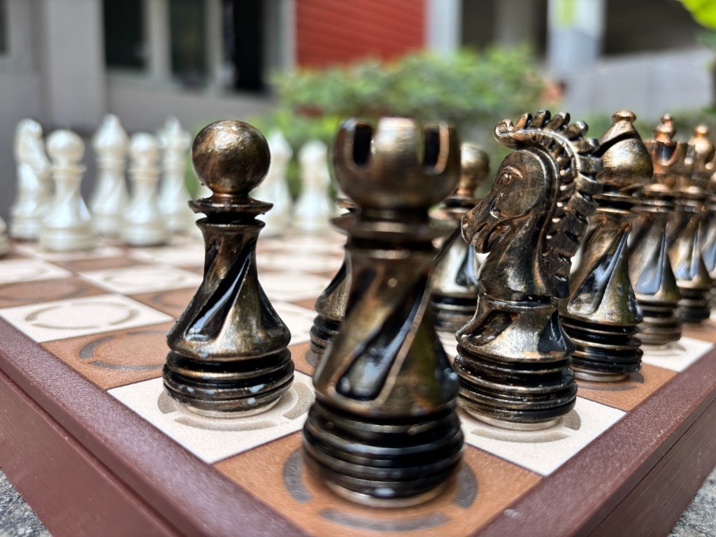 Makura Gambit smart chess board — close-up of hand-finished pieces on the board